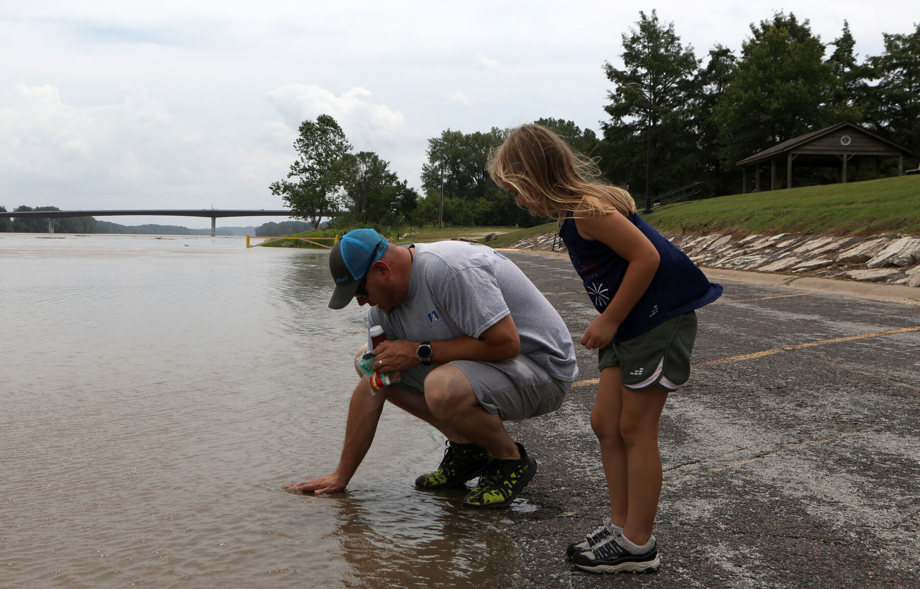 Ross and Amelia McDaniel check the water